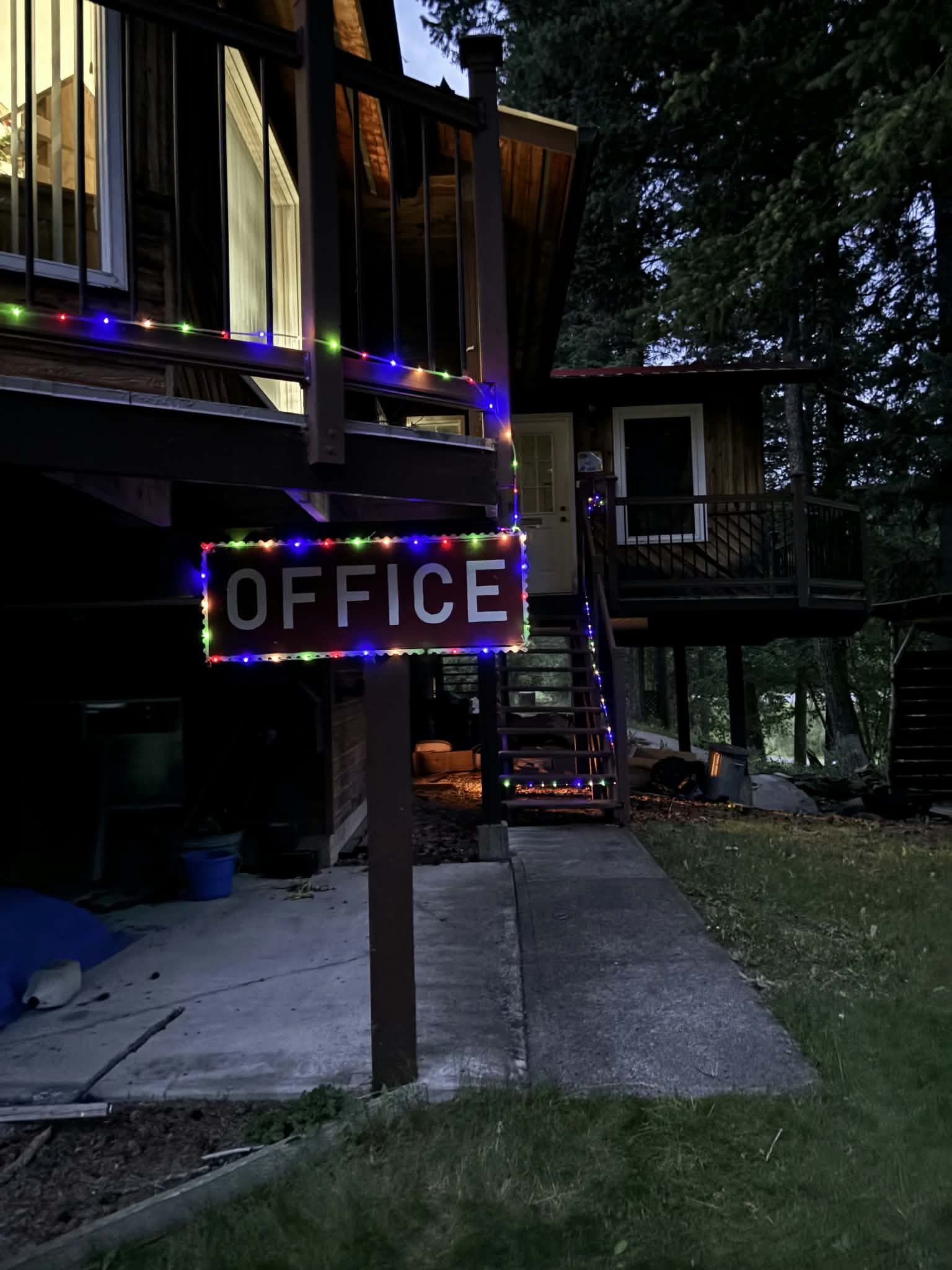 Campground office at Cariboo Place Campsite lit up in the evening