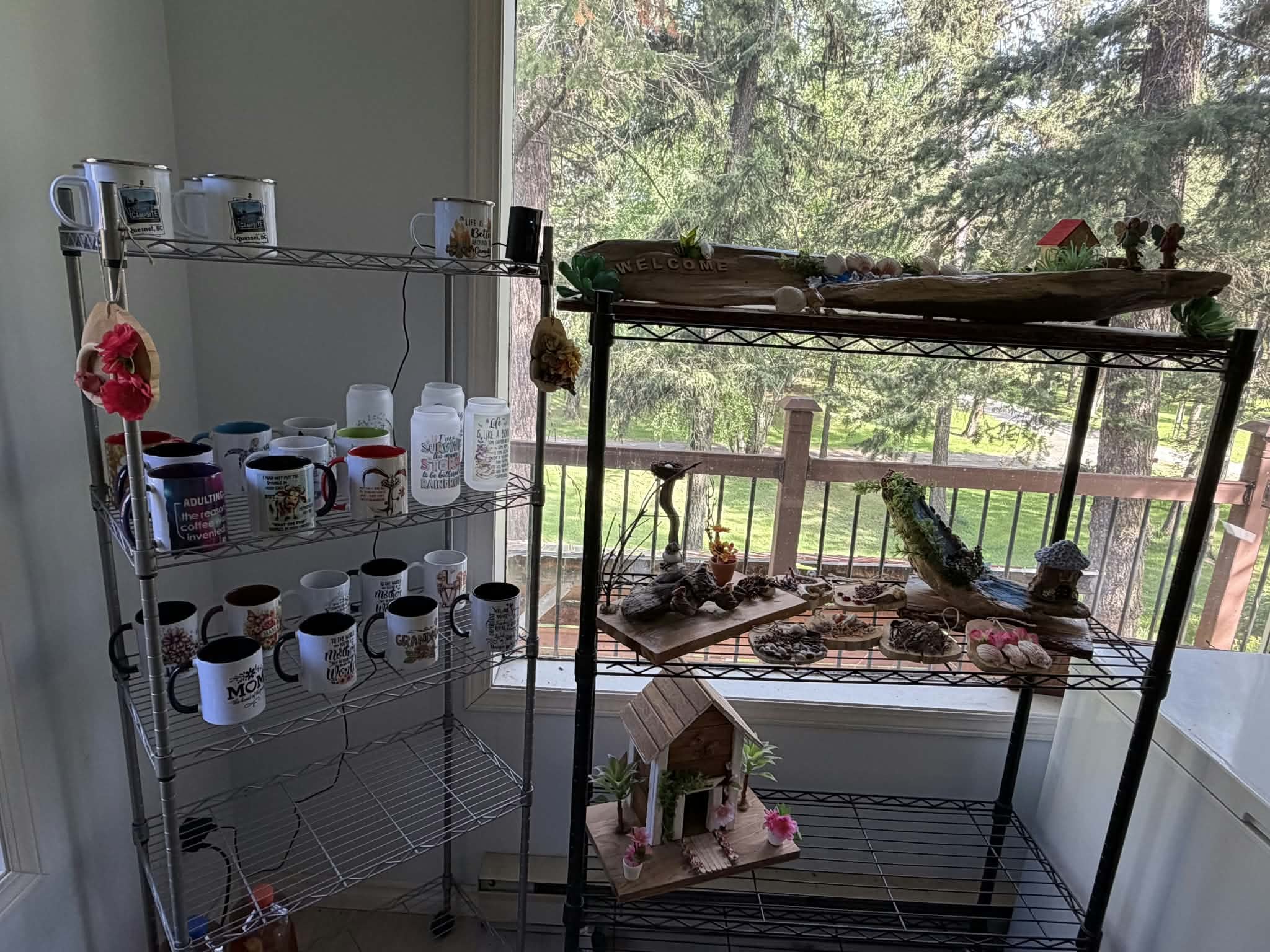 Gift shop shelves in the campground office with camp mugs and handmade crafts